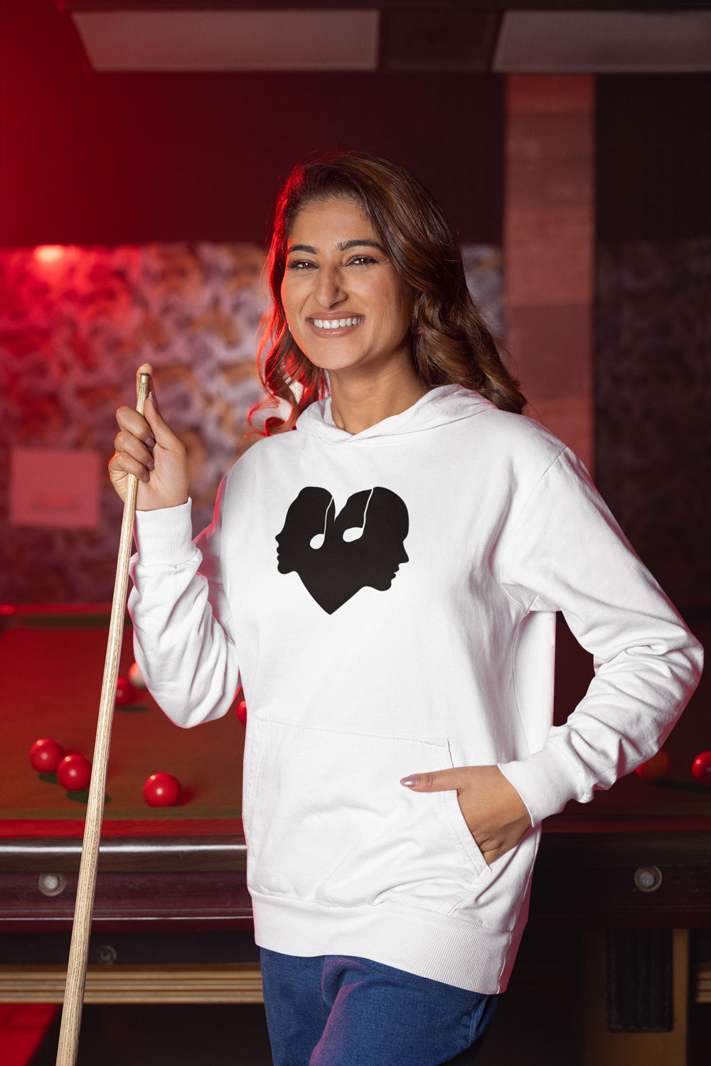 Woman wearing white hoodie with The Sound Of Reflection logo